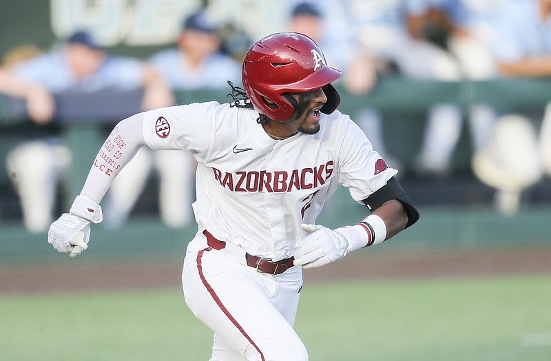 Arkansas infielder Jalen Battles (2) runs to first, Sunday, June 12, 2022 during the ninth inning of the NCAA Baseball Super Regional game 2 at Boshamer Stadium in Chapel Hill, NC. Check out nwaonline.com/220613Daily/ and nwadg.com/photos for a photo gallery...(NWA Democrat-Gazette/Charlie Kaijo)