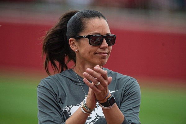 Courtney Deifel, head coach of Arkansas, claps her hands on Saturday, May 28, 2022, before the Texas Longhorns' 3-0 win in Game 3 of the NCAA Softball Super Regional at Bogle Park in Fayetteville. Visit nwaonline.com/220529Daily/ for the photo gallery.