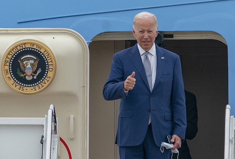 President Joe Biden gestures as he boards Air Force One at Andrews Air Force Base, Md., Tuesday, June 14, 2022. (AP/Gemunu Amarasinghe)
