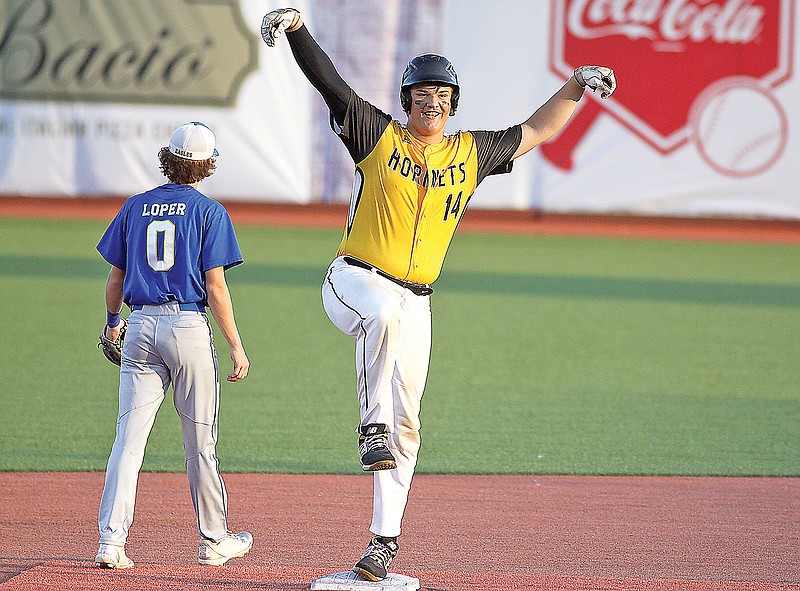 Jace Kesel of St. Elizabeth celebrates at second base after driving in two runs with a double during the Class 1 state championship game in Ozark. (Greg Jackson/News Tribune)