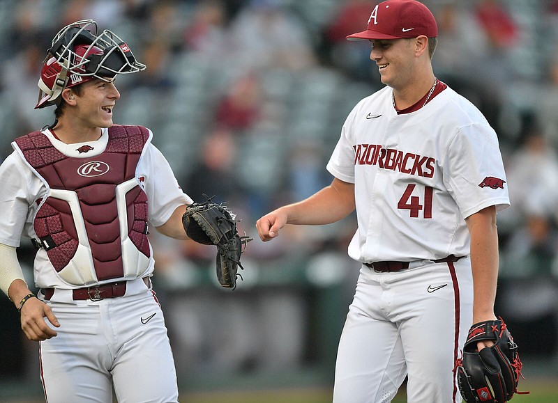 Arkansas starter Will McEntire is congratulated Tuesday, May 3, 2022, by catcher Dylan Leach after recording the final out of the top of the second inning of play against Missouri State at Baum-Walker Stadium in Fayetteville. Visit nwaonline.com/220504Daily/ for today's photo gallery. .(NWA Democrat-Gazette/Andy Shupe)