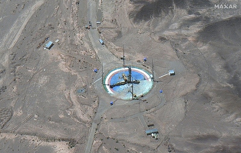 This satellite image shows a rocket preparing to be erected at a launch pad Tuesday at Imam Khomeini Space Center southeast of Semnan, Iran.
(AP/Maxar Technologies)