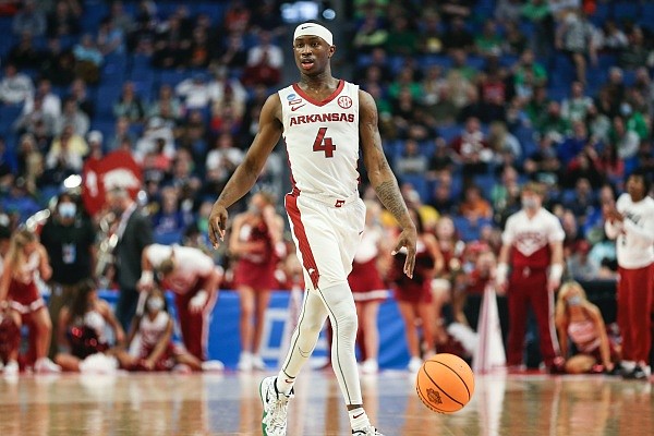 Arkansas guard Davonte Davis looks for an opening, Thursday, March 17, 2022, during the first half of the first round of the 2022 NCAA Division I Men's Basketball Championship at KeyBank Center in Buffalo, N.Y.