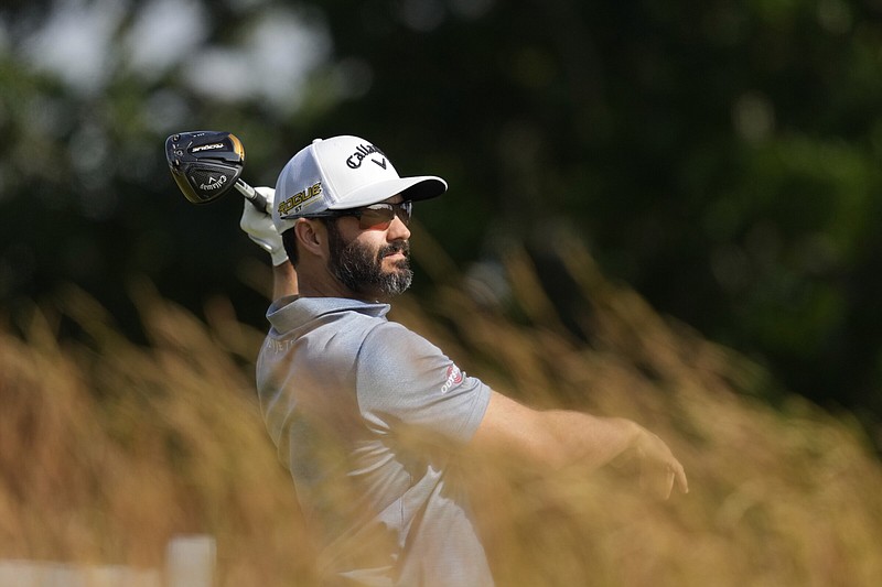 Canada’s Adam Hadwin hits from the 10th tee Thursday during the first round of the U.S. Open at The Country Club in Brookline, Mass. Hadwin shot a 4-under 66 to hold the first-round lead.
(AP/Charlie Riedel)