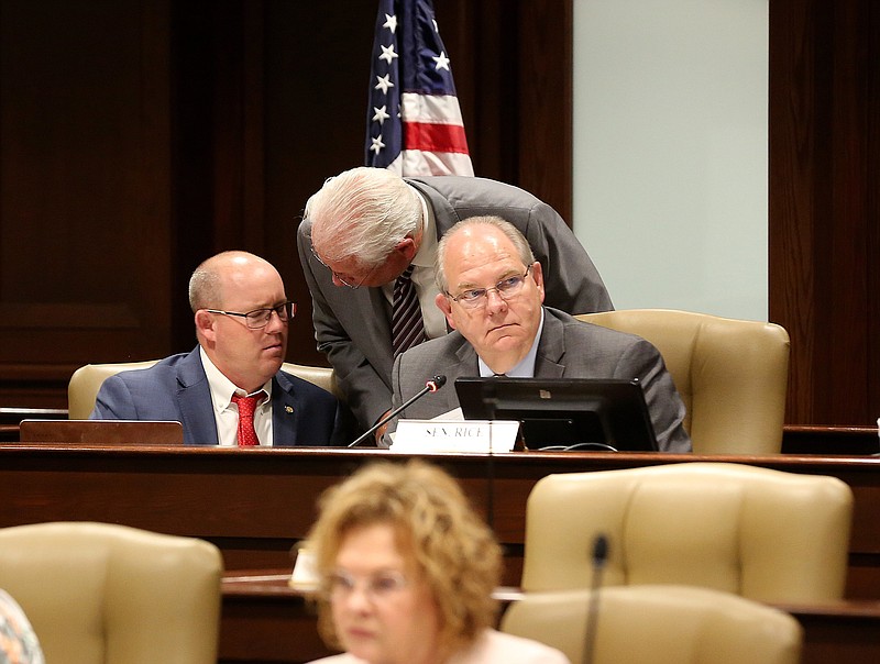 Rep. Jon Eubanks (center), R-Paris, talks with co-chairs Rep. Jeff Wardlaw (left), R-Hermitage, and Sen. Terry Rice, R-Waldron, during the Arkansas Legislative Council meeting on Friday at the state Capitol in Little Rock.
(Arkansas Democrat-Gazette/Thomas Metthe)