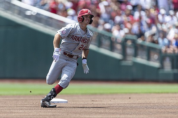 Arkansas Braydon Webb (24) rounds second for a triple in the first inning against Stanford during an NCAA College World Series baseball game Saturday, June 18, 2022, in Omaha, Neb. (AP Photo/John Peterson)