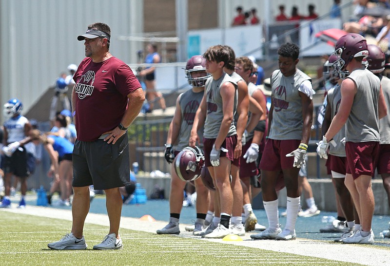Benton Coach Brad Harris (left) watches his team play against Pulaski Academy during the 7-on-7 Shootout of the South on Friday at Pulaski Academy. Harris is getting the Panthers, last season’s 6A-East champion, ready for a move to the 6A-West Conference.
(Arkansas Democrat-Gazette/Colin Murphey)