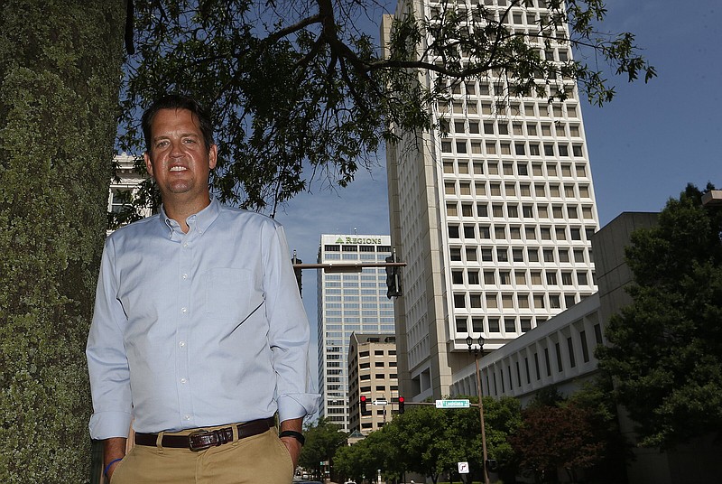 Gabe Holmstrom, Executive Director of the Downtown Little Rock Partnership, stands outside the Bank of America and Regions Bank buildings on Capitol Avenue. The two towers in downtown Little Rock have new owners.
(Arkansas Democrat-Gazette/Thomas Metthe)