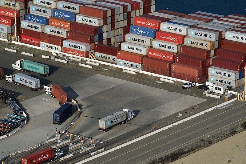 Loaded trucks get ready to leave the Port of Los Angeles in late 2021.
(Bloomberg/Bing Guan)