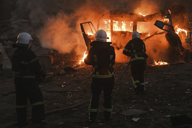 Firefighters work at the site of fire after Russian shelling in Mykolaiv, Ukraine, Saturday, June 18, 2022. (AP Photo/George Ivanchenko)