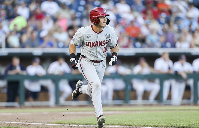 Arkansas Chris Lanzilli (18) runs to first, Tuesday, June 21, 2022 during the seventh inning of a NCAA College World Series elimination game at Charles Schwab Field in Omaha, Neb. Visit nwaonline.com/220622Daily/ for today's photo gallery...(NWA Democrat-Gazette/Charlie Kaijo)