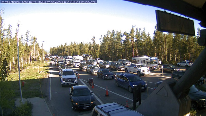 This photo provided by National Park Service shows West Entrance gate traffic on Wednesday, June 22, 2022 at Yellowstone National Park in Montana. (National Park Service via AP)