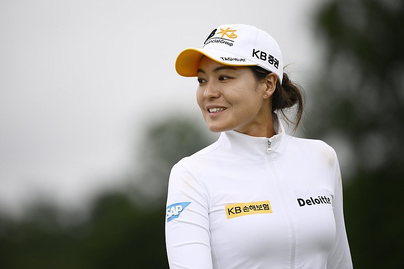 In Gee Chun, of South Korea, smiles after she teed off on the fourth hole during the first round in the Women's PGA Championship golf tournament at Congressional Country Club, Thursday, June 23, 2022, in Bethesda, Md. 
(AP Photo/Nick Wass)