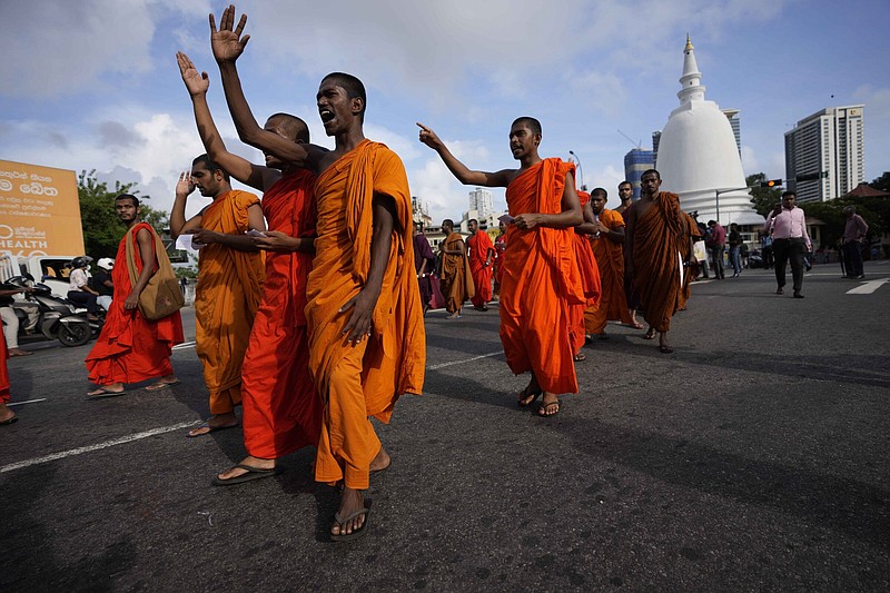 Student Buddhist monks in Colombo, Sri Lanka, shout slogans as they march Monday demanding President Gotabaya Rajapaksa resign over the economic crisis. Sri Lankans are facing a severe economic crisis that has ravaged household budgets amid high inflation.
(AP/Eranga Jayawardena)