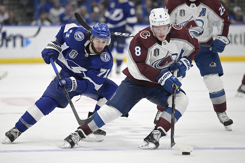 Colorado Avalanche defenseman Cale Makar (right) controls the puck against Tampa Bay Lightning center Anthony Cirelli during Game 4 of the Stanley Cup Final on Wednesday night in Tampa, Fla. The Avalanche hold a 3-1 series lead and can win the franchise’s third Stanley Cup with a victory in Game 5 today in Denver.
(AP/Phelen Ebenhack)