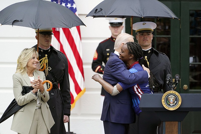 President Joe Biden hugs retired Army Cpl. Danielle Green as first lady Jill Biden looks on Thursday during an event to welcome wounded warriors, their caregivers and families to the White House.
(AP/Susan Walsh)