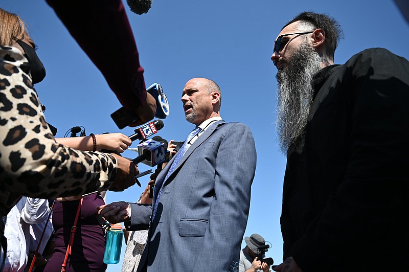 Damien Echols, right, stands with his lawyer, Patrick Benca, as they answer questions from the media following a hearing at the West Memphis District Courthouse on Thursday, June 23, 2022. (Arkansas Democrat-Gazette/Stephen Swofford)