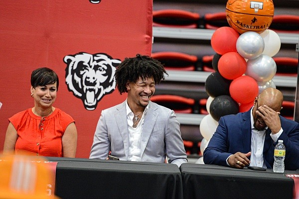 Jaylin Williams (center) from Arkansas sits with mother Linda Williams and father Michael Williams on Thursday, June 23, 2022, at a 2022 NBA Draft watch party inside Grizzly Arena at Northside High School in Fort Smith. Visit nwaonline.com/220624Daily/ for the photo gallery.