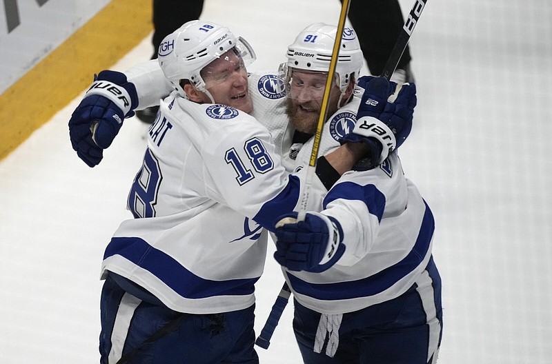 Ondrej Palat (left) and Steven Stamkos of the Tampa Bay Lightning celebrate after Palat’s goahead goal in the third period of the Lightning’s victory over Colorado Avalanche on Friday night in Game 5 of the Stanley Cup Final.
(AP/David Zalubowski)