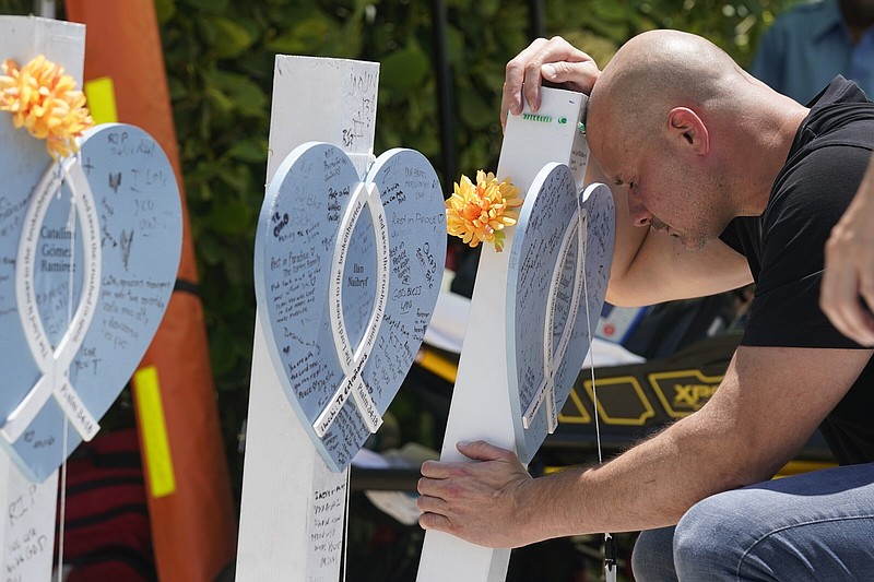 Lazaro Carnero mourns for his best friend Edgar Gonzalez, during a remembrance event at the site of the Champlain Towers South building collapse, Friday, in Surfside, Fla.
(AP/Wilfredo Lee)