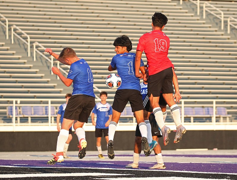 Players for the East and West vie for a loose ball during the Arkansas High School Coaches Association All-Star boys soccer game Friday in Conway. The West won 2-1. See more photos at arkansasonline.com/625boyssoccer/
(Arkansas Democrat-Gazette/Colin Murphey)