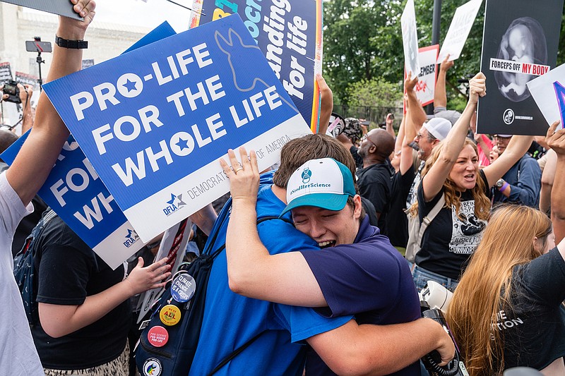 Anti-abortion demonstrators rejoice Friday outside the Supreme Court building after the decision was announced. 
(The Washington Post/Eric Lee)