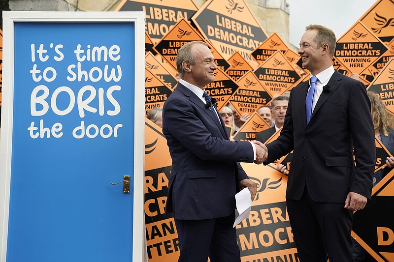 Liberal Democrat Leader Ed Davey (left) celebrates with Richard Foord, the newly-elected Liberal Democrat lawmaker for Tiverton and Honiton on Friday in Crediton, England.
(AP/PA/Andrew Matthews)