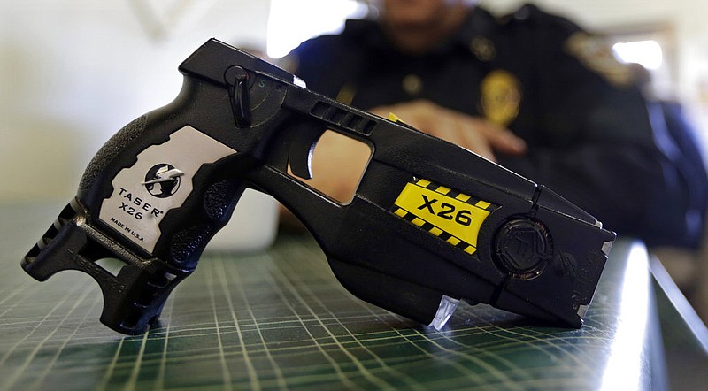 A Taser X26, a type of stun gun, is displayed in this Nov. 14, 2013 file photo. (AP/Michael Conroy)