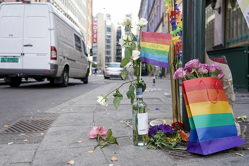 Flowers are left at the scene of a shooting in central Oslo, Saturday, June 25, 2022. Norwegian police say they are investigating an overnight shooting in Oslo that killed two people and injured more than a dozen as a case of possible terrorism. In a news conference Saturday, police officials said the man arrested after the shooting was a Norwegian citizen of Iranian origin who was previously known to police but not for major crimes. (Hakon Mosvold Larsen/NTB Scanpix via AP)