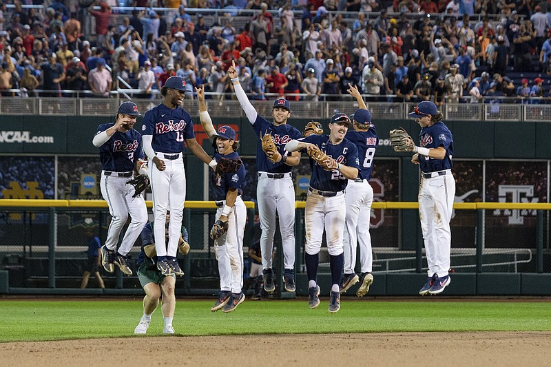 Mississippi's infielders and outfielders celebrate after Saturday night's win against Oklahoma in the College World Series in Omaha, Neb. (The Associated Press)