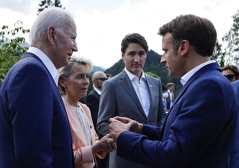 From left, U.S. President Joe Biden, European Commission President Ursula von der Leyen, Canada's Prime Minister Justin Trudeau and Emmanuel Macron, Prime Minister of France talk as they attend a family photo opportunity at Castle Elmau in Kruen, near Garmisch-Partenkirchen, Germany, on Sunday, June 26, 2022. The Group of Seven leading economic powers are meeting in Germany for their annual gathering Sunday through Tuesday. (Jonathan Ernst/Pool Photo via AP)