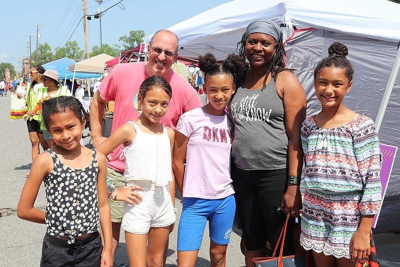 Ely Moore (background) with Mia, Jaleah and Jaylynn Moore; Dr. Keneshia Bryant-Moore; and Alaya Moore at Juneteenth in Da Rock, hosted by Mosaic Templars Cultural Center and held June 18, 2022, outside (and inside) the Little Rock museum.
(Arkansas Democrat-Gazette/Helaine R. Williams)