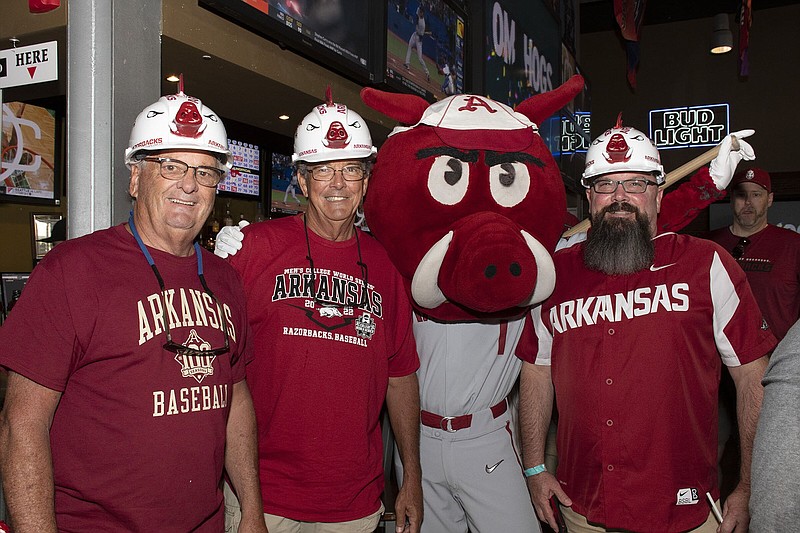 Tommy Cupples, Ron Fortenbury and John Stuart, all of North Little Rock, on 6/18/2022 at the University of Arkansas Alumni and UA Foundation Brunch held at DJ's Dugout Bar and Grill before the first game of the Razorback Baseball Team at the College World Series.
(Arkansas Democrat-Gazette/Cary Jenkins)