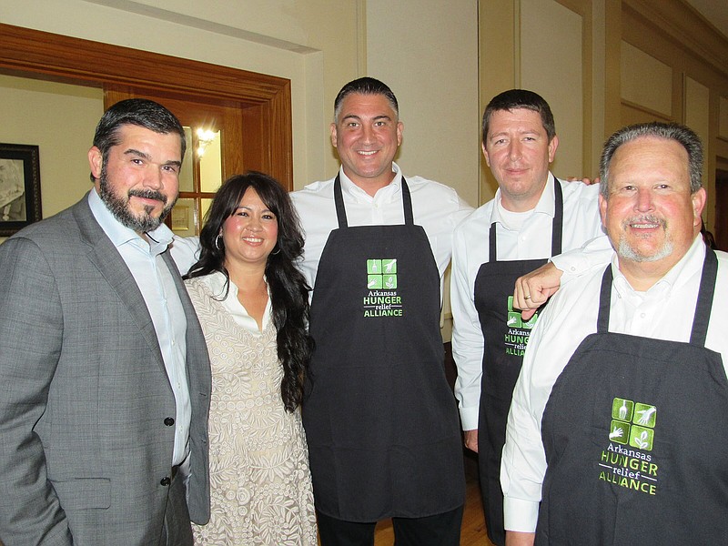 Brad and Sherry Nye, Clint Penzo, Josh Bryant and Howard Beaty on 06/16/22 at Serving Up Solutions, Albert Pike Masonic Temple 
(Arkansas Democrat-Gazette/Kimberly Dishongh)