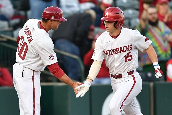 Arkansas catcher Dylan Leach is congratulated by assistant coach Nate Thompson Tuesday after hitting a solo home run during the third inning of play against Missouri State at Baum-Walker Stadium in Fayetteville. Arkansas catcher Dylan Leach is congratulated by assistant coach Nate Thompson Tuesday after hitting a solo home run during the third inning of play against Missouri State at Baum-Walker Stadium in Fayetteville.