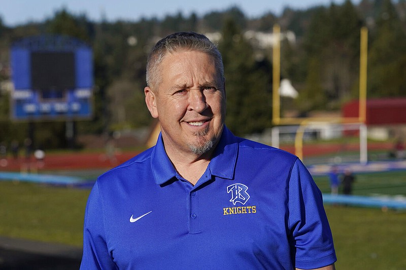 FILE - Joe Kennedy, a former assistant football coach at Bremerton High School in Bremerton, Wash., poses for a photo March 9, 2022, at the school's football field. (AP/Ted S. Warren, File)