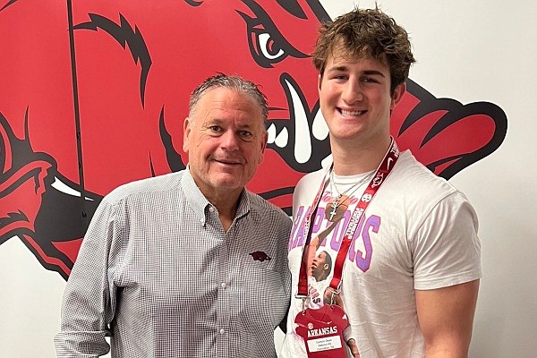 Arkansas coach Sam Pittman and Razorbacks linebacker commit Carson Dean during his March 5 visit.