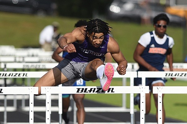 Fayetteville High School’s Isaiah Sategna competes in the 110-meter hurdles during the 6A State Track Championship at Scott Field in Little Rock.