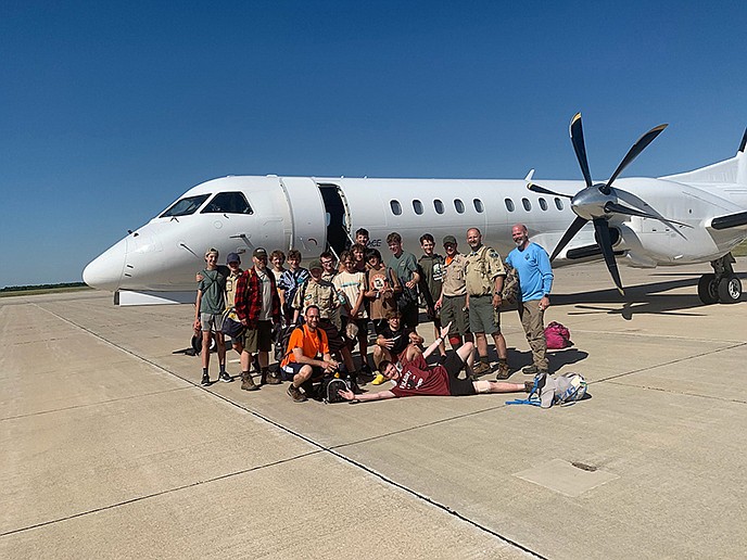 Members of Boy Scout Troops 12 and 73 of Appleton, Wis., get a group portrait with Scout leaders and parents on Monday before flying home from Missouri after doing their good deeds when the Amtrak train they were aboard crashed into a dump truck.
(Photo courtesy of Dan Skrypczak)