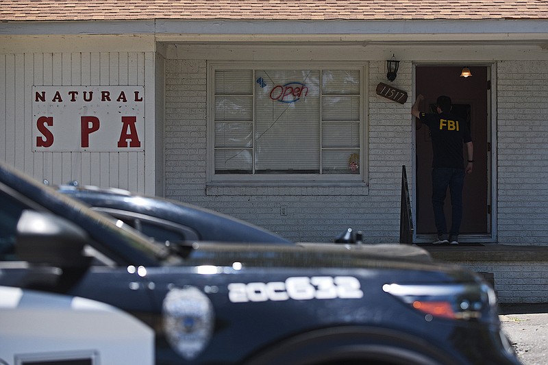 The FBI conducts a court-authorized operation with the Little Rock Police Department on Wednesday at Natural Spa on Kanis Road.
(Arkansas Democrat-Gazette/Staci Vandagriff)