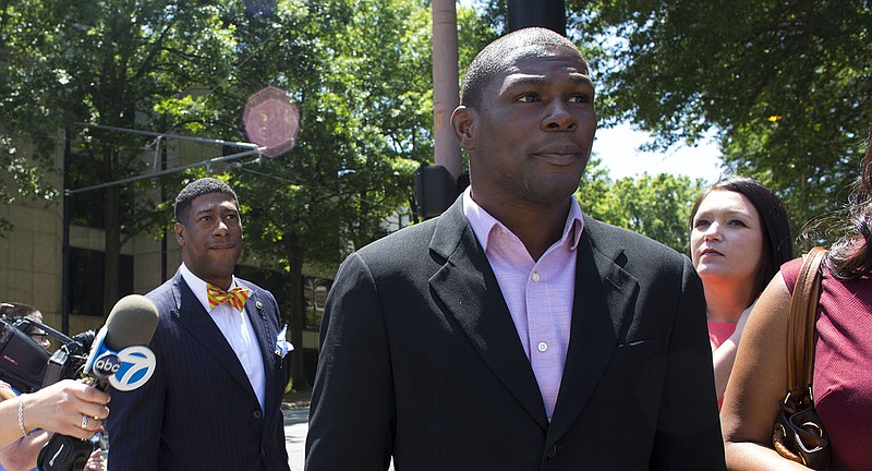 Jermain Taylor leaves the Pulaski County Courthouse with members of his counsel after being ordered to six years of a suspended sentence in a trio of felony cases in this May 20, 2016 file photo. (Arkansas Democrat-Gazette file photo)
