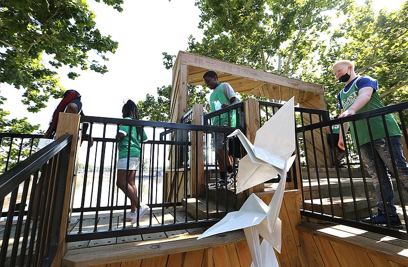 Children take advantage of the new Margaret Clark Tree House on Thursday after a grand-opening ceremony for the treehouse located in Riverfront Park in Little Rock.
(Arkansas Democrat-Gazette/Thomas Metthe)