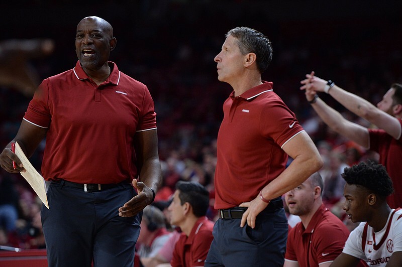 Arkansas men’s basketball Coach Eric Musselman (right) makes a point of taking input from all of his assistants, including Keith Smart, a former NBA head coach who played for Musselman in the CBA with the Rapid City Thrillers and Florida Beachdogs. Musselman calls his staff meetings a “think tank.”
(NWA Democrat-Gazette/Andy Shupe)