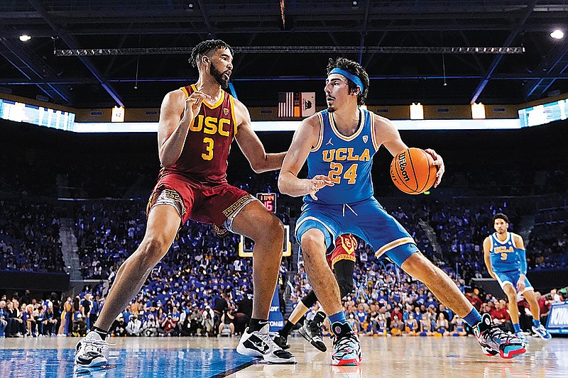 UCLA guard Jaime Jaquez Jr., right, tries to get by Southern California forward Isaiah Mobley during the second half of an NCAA college basketball game on March 5, in Los Angeles. UCLA and Southern California are planning to leave the Pac-12 for the Big Ten Conference. (Associated Press)