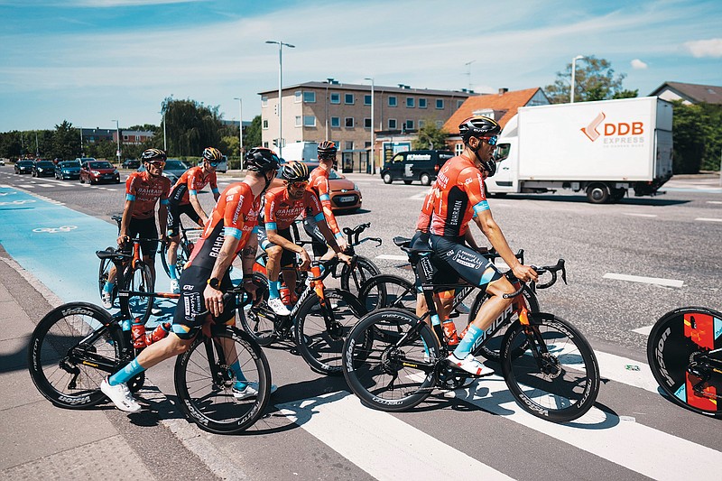 Team Bahrain Victorious riders return after a training Thursday near Copenhagen, Denmark. Riders and staff from the Bahrain Victorious team had their homes searched by police before they left for Denmark and the team’s hotel was searched by Danish police early in the morning in the ongoing investigation. The Tour de France cycling race starts  today with the first stage, an individual time trial for 8.2 miles with start and finish in Copenhagen. (Associated Press)