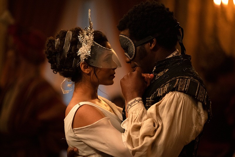 A revenge-minded Selina Dalton (Freida Pinto) canoodles with the unsuspecting Mr. Malcolm (Sope Dirisu) in Emma Holly Jones’ Regency-era drama “Mr. Malcolm’s List.”