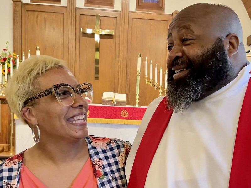 Pastor Randall Lewis and his wife, Kim, pause following his June 19 ordination as a Minister of Word and Sacrament in the Lutheran Church — Missouri Synod before heading to a reception in his honor.
(Arkansas Democrat-Gazette/Frank E. Lockwood)