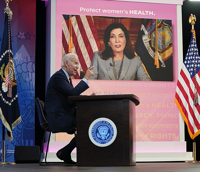 President Joe Biden holds a virtual meeting on abortion Friday with Democratic governors, including New York Gov. Kathy Hochul (on screen). Biden said he is “looking at all the alternatives” for continued access. More photos at arkansasonline.com/72dobbs/.
(AP/Evan Vucci)