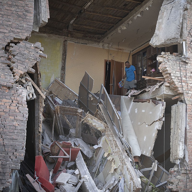 A man salvages belongings from an apartment that was destroyed Friday in a Russian rocket attack in the city center of Bakhmutin in eastern Ukraine’s Donetsk province. At least four people were killed, officials said. Another attack in Serhiivka near Odesa killed at least 21 people. More photos at arkansasonline.com/ukrainemonth5/.
(AP/Efrem Lukatsky)