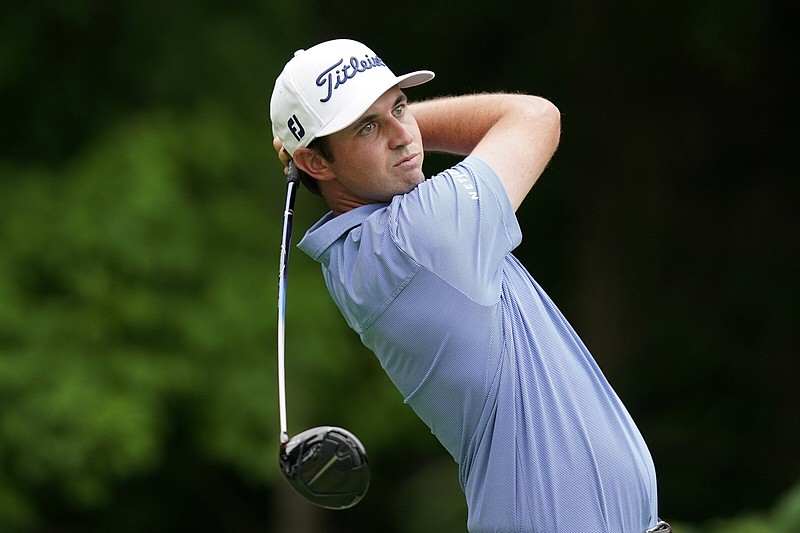 J.T. Poston hits a tee shot on No. 2 in the second round of the John Deere Classic on Friday at TPC Deere Run in Silvis, Ill. Poston leads the field by three strokes at 15 under heading into today’s third round.
(AP/Charlie Neibergall)